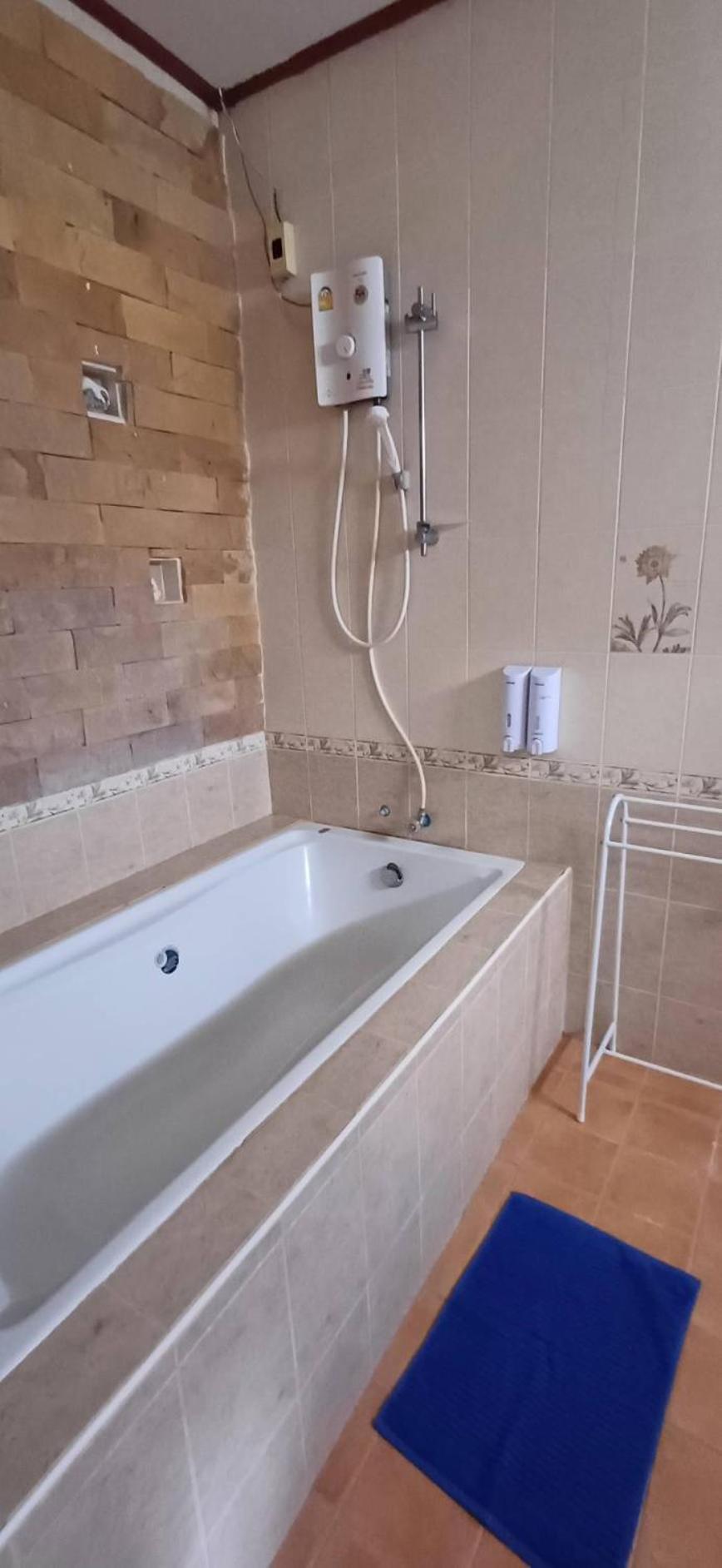 Orchid Home Тау Экстерьер фото